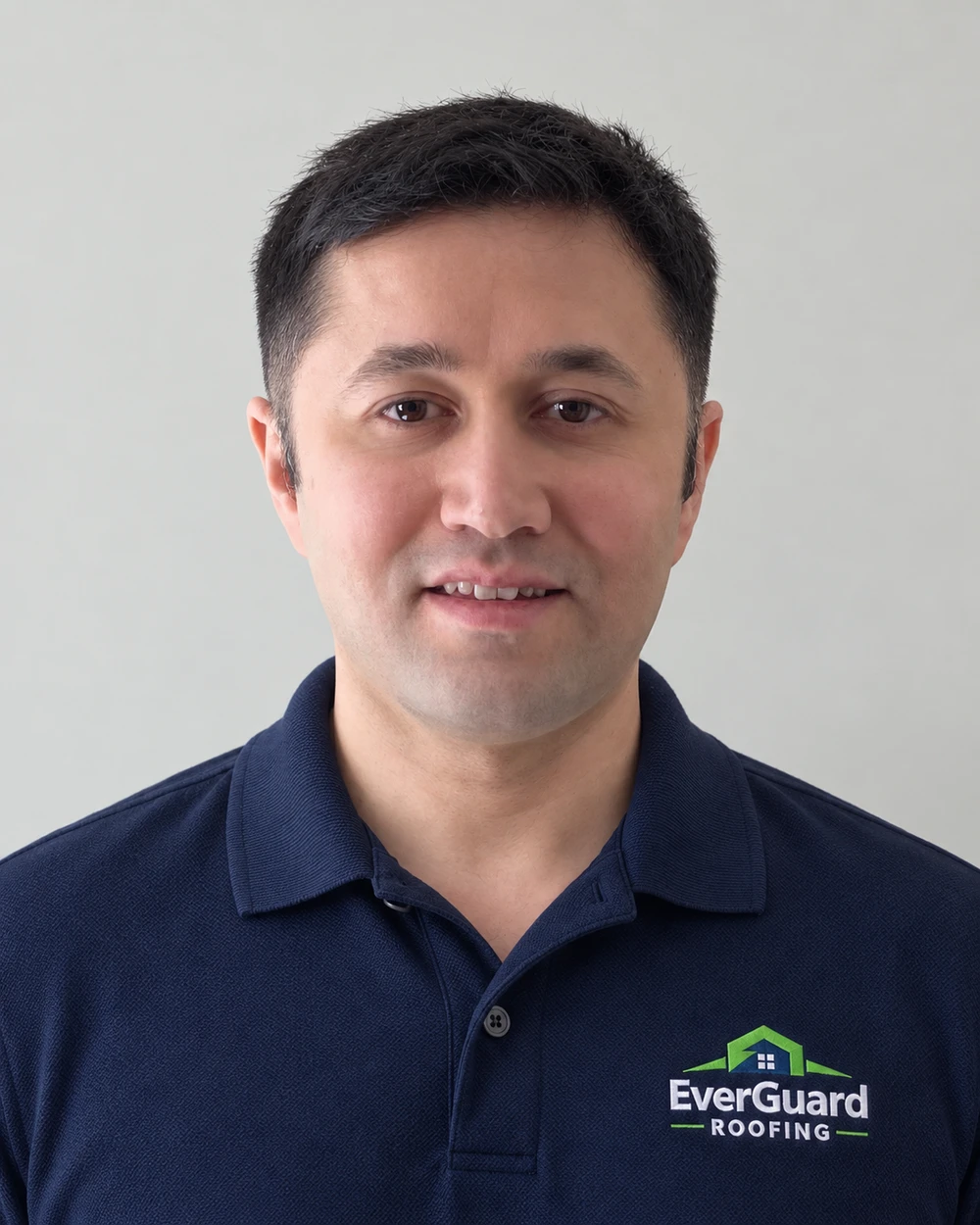 Damir Amonov wearing a navy EverGuard Roofing polo